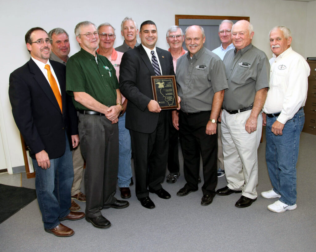 The Spoon River Electric Cooperative Board of Directors congratulates State Rep. Mike Unes (R-East Peoria), who was awarded the Illinois Electric Cooperatives’ Public Service Award. Pictured in the front row (left to right) are Director John Spangler, Director Greg Leigh, Rep. Mike Unes, President/CEO Bill Dodds, Board Chairman Jack Clark and Director Lyle Nelson. In the back row (left to right) are Directors Bob Lascelles, Terry Beam, Steve Pille, Jim Banks and Bernard Marvel.