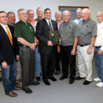The Spoon River Electric Cooperative Board of Directors congratulates State Rep. Mike Unes (R-East Peoria), who was awarded the Illinois Electric Cooperatives’ Public Service Award. Pictured in the front row (left to right) are Director John Spangler, Director Greg Leigh, Rep. Mike Unes, President/CEO Bill Dodds, Board Chairman Jack Clark and Director Lyle Nelson. In the back row (left to right) are Directors Bob Lascelles, Terry Beam, Steve Pille, Jim Banks and Bernard Marvel.