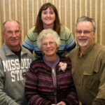 JoAn, center, with her children (l-r) Michael, Linda and Mark.