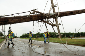 Western Farmers Electric Cooperative contractor crews work on damaged areas in the Moore, Okla. 