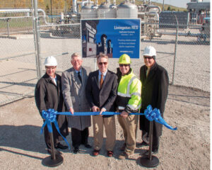 From the left, Association of Illinois Electric Cooperatives President/CEO Duane Noland, Hoosier Energy Board Chairman Jim Weimer, Hoosier Energy President/CEO Steve Smith, Republic Services Environmental Manager Eric Dippon, and AIEC Sr. Vice President of Government Relations Don Wood cut the ribbon to the new 154 MW methane gas generating facility near Pontiac.