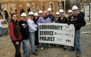 Community service volunteers included Kevin Bernson, Vice President of Media and Public Relations at Shelby Electric Cooperative (third from left) and Aaron Ridenour, Manager of Marketing & Business Development at Prairie Power, Inc. (on far right).