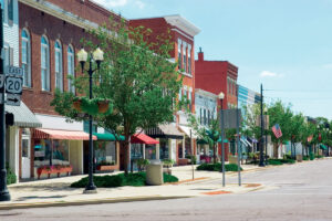 A main street in a typical midwest small town, complete with U.S. flags.