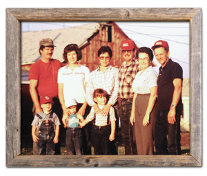 Phil Carson family photo from the early 1980s with a red barn in the background