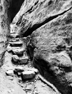Crumbling stone steps between two rock walls