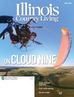 April cover features a man flying through the air, mid-flip on a paramotor. The title reads "On Cloud Nine"