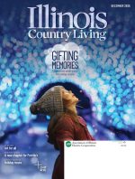 A girl bundled up in her winter clothes and hat looks up in wonder at the blue and white lights above her