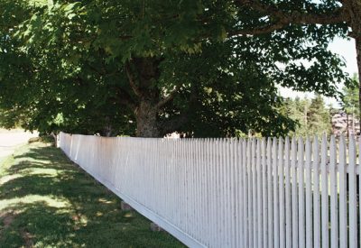 White picket fence on lawn