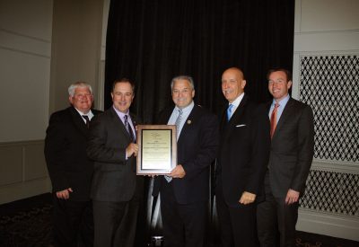 The IMEA presented its 2016 Public Service Award to the AIEC. The two consumer-owned utility associations work together to protect the interests of consumer-owned utilities in the state. From the left are AIEC General Counsel Norman Conrad, AIEC President and CEO Duane Noland, IMEA President and CEO Kevin Gaden, Senior Vice President of Government Relations Don Wood and Manager of Government Relations Nick Reitz.