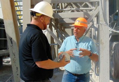 CMEC-Charleston Stone: Mike Vaughn (right), Charleston Stone ­operations ­manager, discusses company operations with Sam Adair, CMEC ­manager of marketing and member services.