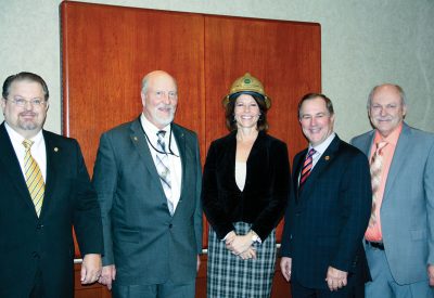 U.S. Rep. Cheri Bustos receives a golden hard hat and the 2015 Illinois Electric Cooperatives’ Public Service Award. With Bustos are (l-r) Michael Hastings, President and CEO of Jo-Carroll Energy; David Senn, Chairman of the Jo-Carroll Energy board of directors; Duane Noland, President and CEO of the Association of Illinois Electric Cooperatives and Bill Dodds, President and CEO of Spoon River Electric Cooperative.