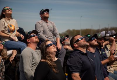 Egyptian Electric Cooperative Association employees watch the solar eclipse on April 8 at the co-op’s headquarters in Murphysboro.