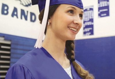 Girl in Cap ad Gown Graduating