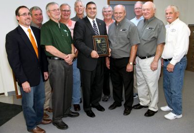 The Spoon River Electric Cooperative Board of Directors congratulates State Rep. Mike Unes (R-East Peoria), who was awarded the Illinois Electric Cooperatives’ Public Service Award. Pictured in the front row (left to right) are Director John Spangler, Director Greg Leigh, Rep. Mike Unes, President/CEO Bill Dodds, Board Chairman Jack Clark and Director Lyle Nelson. In the back row (left to right) are Directors Bob Lascelles, Terry Beam, Steve Pille, Jim Banks and Bernard Marvel.