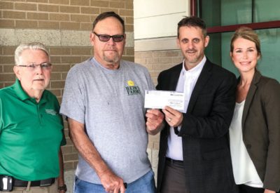 On hand for the check presentation were (L-R) EECA Board President Ken Jarrett, Degognia-Fountain Bluff Levee District Board Chair Carl Heins, EECA General Manager Shane Hermetz and EECA Member Services Manager Brooke Guthman.