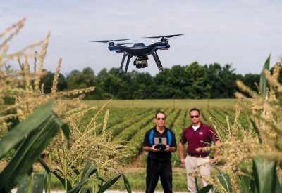Dennis Watson, left, and Chris Clemons, faculty members in the Department of Agricultural Systems and Education at Southern Illinois University Carbondale, test fly a 3D Robotics Solo unmanned aerial vehicle, popularly known as a drone. The university is adding a ­component on agricul­tural drones to its curriculum. (Photo by Russell Bailey)