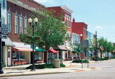 A main street in a typical midwest small town, complete with U.S. flags.